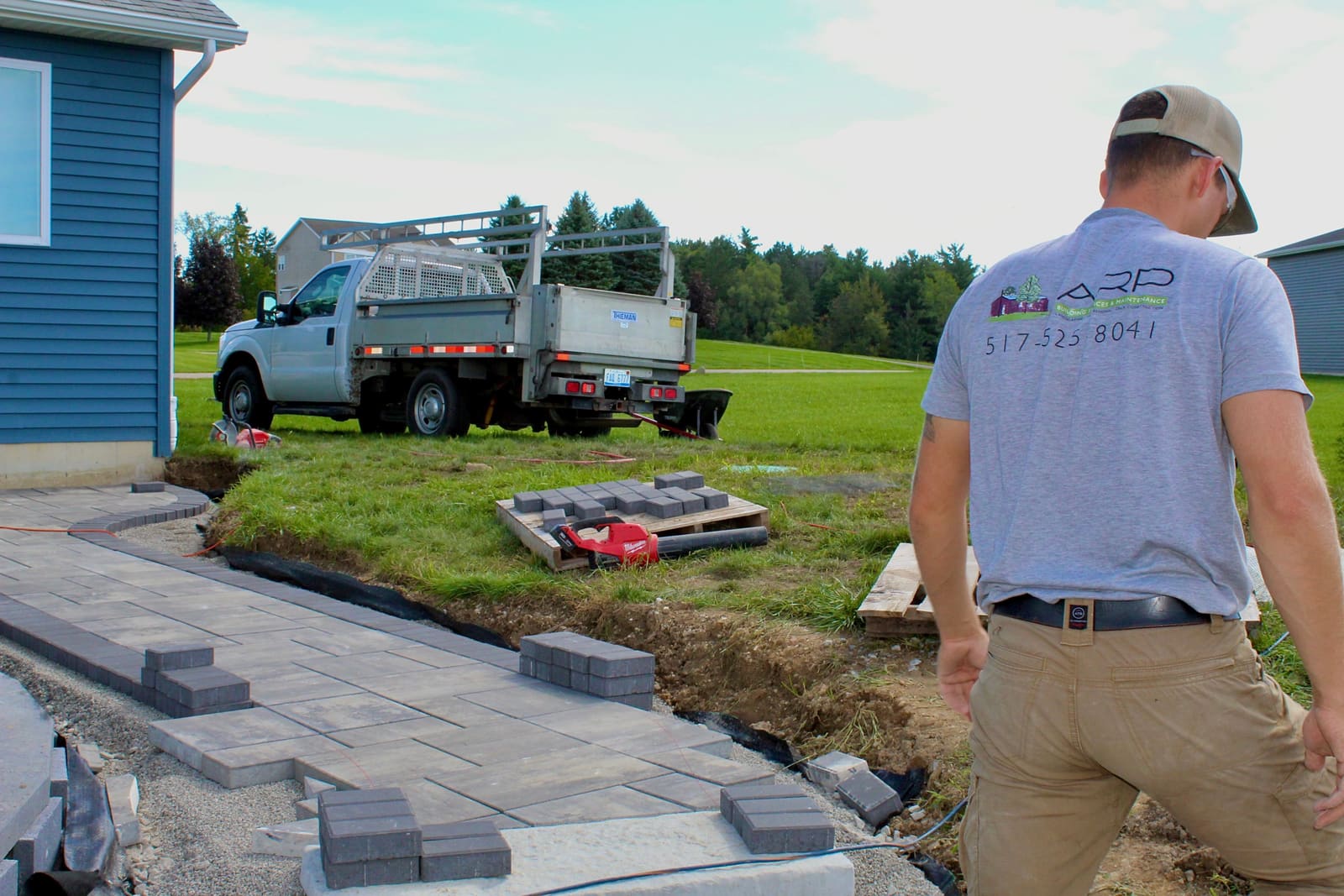 ARP Building Services crew on-site installing a paver walkway