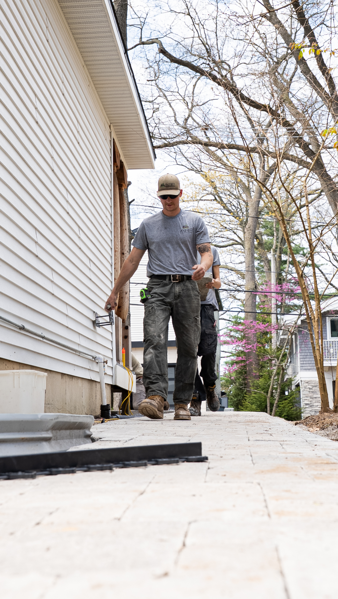Crew Installing a Long Paver Walkway